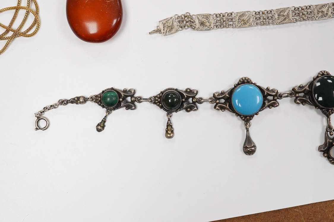 A collection of assorted jewellery including a stylish textured 925 necklace, 76cm and a similar bracelet, 18cm, a Portuguese white metal hinged bracelet, a white metal necklace with amberoid pendant, a white metal and g